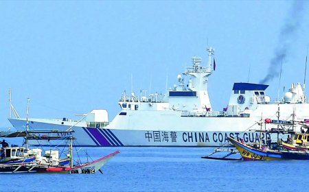 Philippines vows removal of Chinese barriers at disputed reef