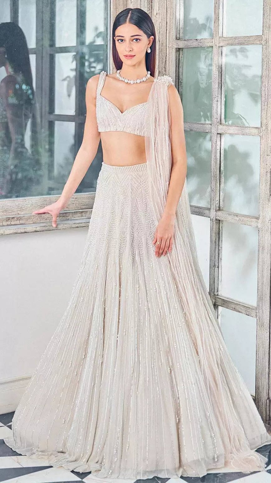 Ananya looks like a vision in a white pearl lehenga