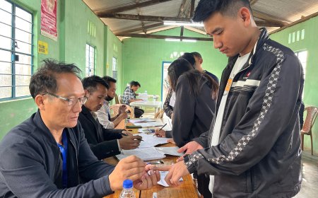 A polling official administering indelible ink to a voter, at a polling booth, during the 1st Phase of General Elections-2024 at Kohima